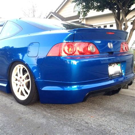 Ive seen a couple of 03-04 with the mugen rear lip all