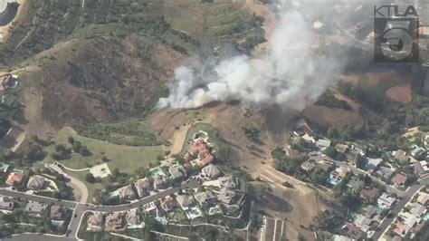 Multi-acre brush fire threatening homes in Los Angeles County contained