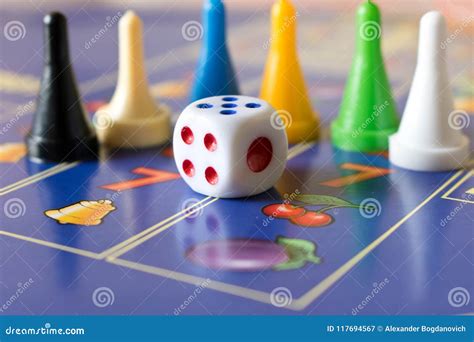 Multicolored Game Chips with Dice on the Playing Board. Board Game