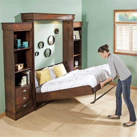 Murphy bed mattress. Make sure your mattress will fit inside the murphy bed frame and not exceed the weight capacity of the murphy bed frame. A 12-inch Tempurpedic mattress will fit most Murphy bed frames that have weight capacities over 500 lbs. Do not fold the mattress into the wall every morning, according to Tempurpedic. 