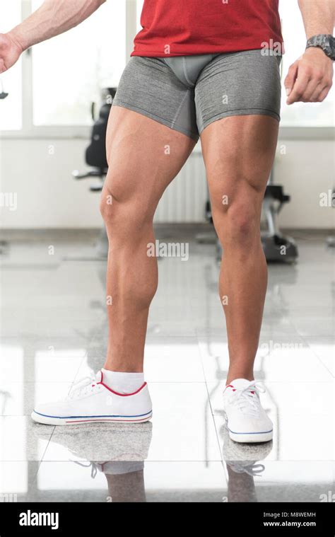 Muscle men with legs spread.  Download Muscular bodybuilder with legs spread open, seen from the...