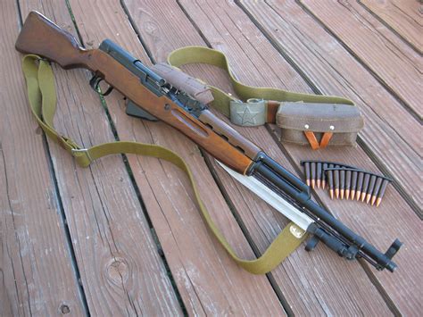 Description: 1954 Tula Arsenal Russian SKS rifle chambered in 7.62x39mm. Features a nice blue finish, desirable solid wood stock, and bolt and blade bayonet are still in the white. All parts are matching except the magazine box, and stock shows an arsenal rebuild mark. Very nice Russian made SKS that are getting harder to find.. 