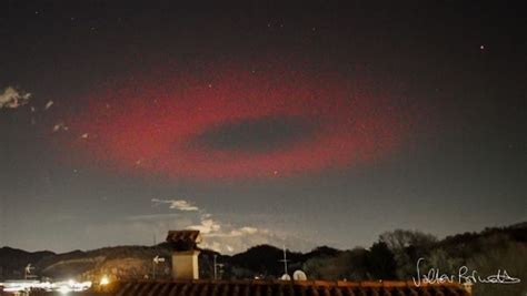 Mysterious red UFO-like ring photographed looming in sky above …