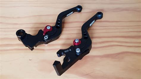 Mzs levers. ADJUSTABLE REACH - By simply adjusting a bolt on the MZS clutch brake lever, the reach can be adjusted to accommodate the smallest to the largest hands and gives the best clutch or brake response. HIGH QUALITY COMPONENTS - MZS dirt bike levers use chrome steel precision sealed bearings, stainless steel pivot and bushing parts, chrome silicon … 