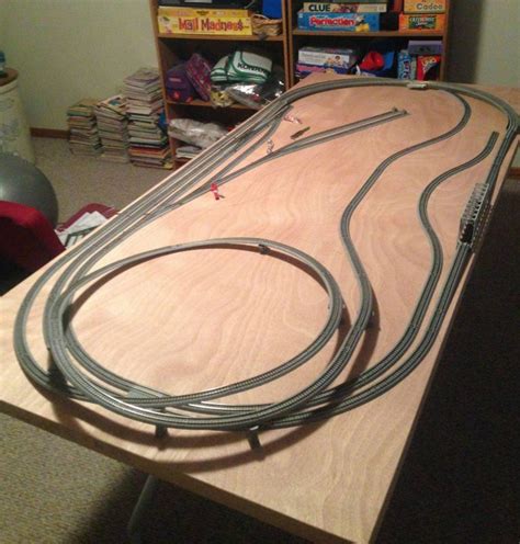 N scale layouts on a door. So, allowing 1/2" for support structure and Unitrack roadbed thicknesses, figure 2-1/2" from top of rail to top of rail. The grades should be 4% maximum for the equipment you want to run, 2% is preferred. That means you must have a minimum 62.5" (>5 feet) run at 4% to have 2-1/2" from rail top to rail top. 