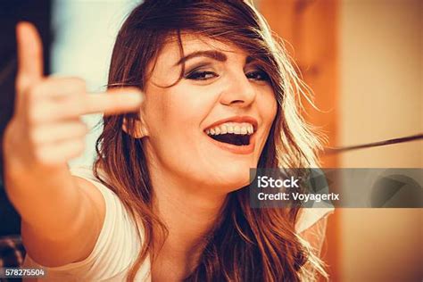 Naked chicks giving middle finger.  Find high resolution royalty-free im...