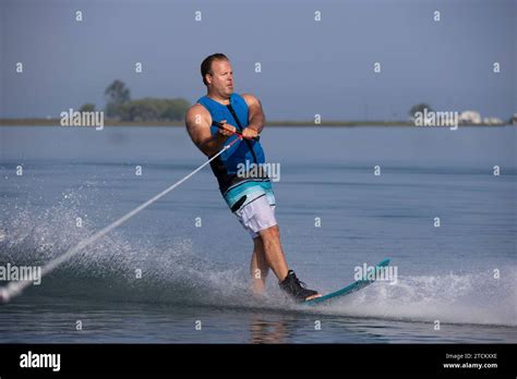Naked male waterski. .  ...
