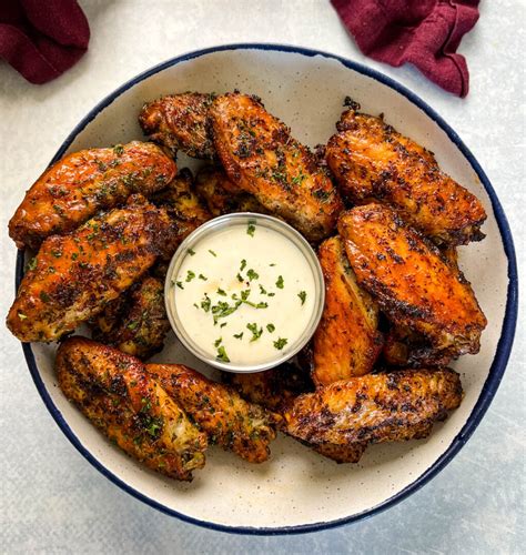 Naked wings. In a large bowl, toss the wings with melted butter. Arrange the coated wings in a single layer on the wire racks, not touching each other. Sprinkle them with salt, pepper, garlic powder, and paprika. Bake … 