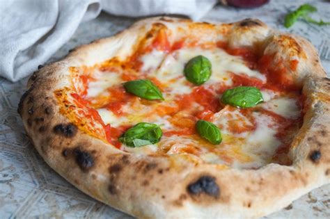 Napoletana pizza. The first pizza is believed to have been made in Naples by Raffaele Esposito in 1889. Other variations of flat breads with and without toppings were created previously by Egyptians... 