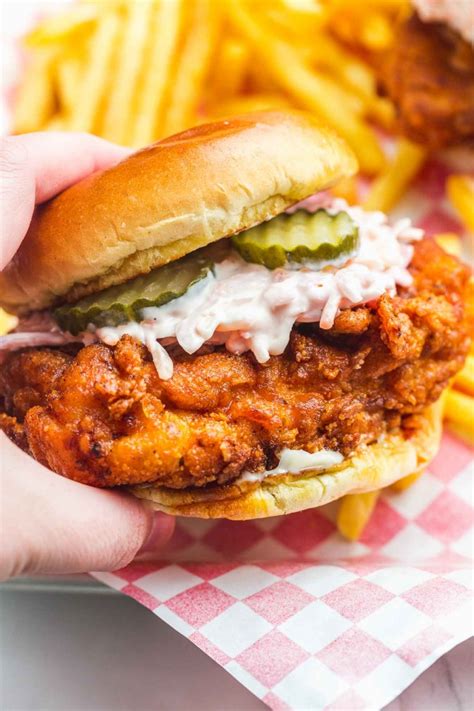 Nashville hot chicken sandwich recipe. Healthier version of the classic. Chicken breasts marinated with Nashville Hot Seasoning, grilled and served in a brioche bun with pickles and ranch dressing. 