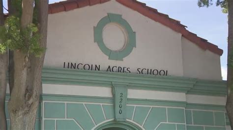 National School District pressed to address teacher's arrest