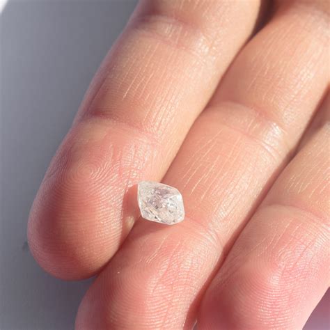 Natural diamond. A diamond is made up of billions of carbon atoms. Each carbon atom in a diamond is strongly bonded to four others, making them the hardest known natural substance. Diamonds also exhibit high thermal conductivity, are resistant to chemicals and have an exceptionally high transparency. The formation of diamonds was shaped by explosive natural forces. 