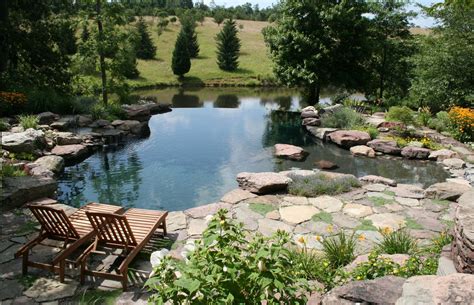 Natural pond pool. Natural swimming pools are built in either one- pot or two-pot designs. In one-pot designs, the regeneration zone is contained within the same chamber as the swimming area. The water flows over the top of a shallow retaining wall between the two areas. In two-pot designs, the swimming area and regeneration zone are their own separate vessels. 