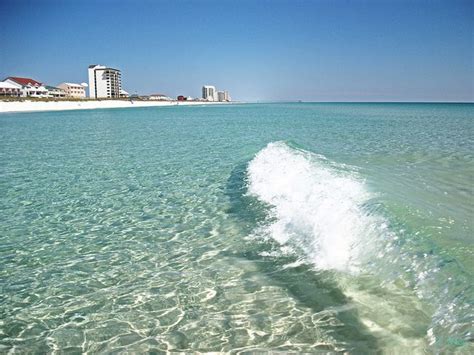 Navarre beach water. 1. Destin Beach. This beach is a dessert of sugar-white sands and glazed emerald waters. Located in Henderson Beach State Park on Florida's Emerald Coast, Destin Beach unfurls with 6,000 feet of beautiful Gulf of Mexico coastline. This combination makes it one of the most beautiful beaches in the world. 