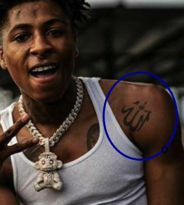 Nba youngboy tatoos. Meaning: YoungBoy got the news, MOM tatstooed on how his your for his mother, Sherhonda Gaulden. He got the name, Jania tattooed to show his affection used his then-girlfriend. 3. Heart Tattoo. Tattoo: There is a tattoo of a tiny focus done in black ink to the side on his right eye. 