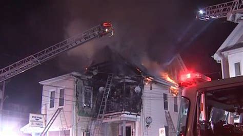 Neighbors recount woman who leapt to safety from roof, escaping Brockton blaze that displaced 8