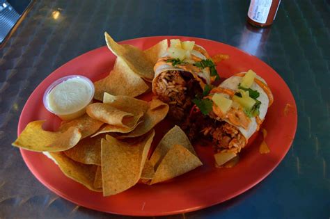 Large Basic Burrito Combo $12.00. Rice, choice of beans, cheese, pico, sour cream and guacamole. Served with 2 oz. queso with chips and a fountain beverage. Large Chipotle BBQ Chicken Burrito $11.75. Rice, choice of beans, BBQ chicken, cheese, guacamole, avocado ranch, corn and bean salsa.. 