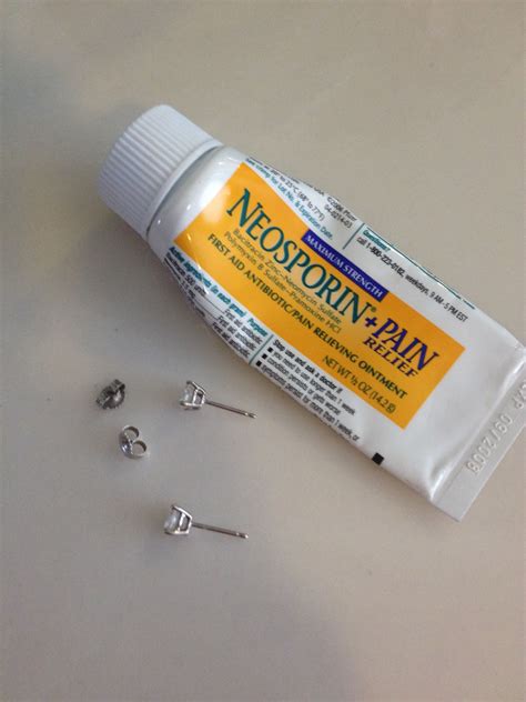 Neosporin piercing. Neosporin and Polysporin are never to be used on any body piercing, read the back of the tube. It clearly states not to be used on puncture wounds, a body piercing is a puncture wound. 
