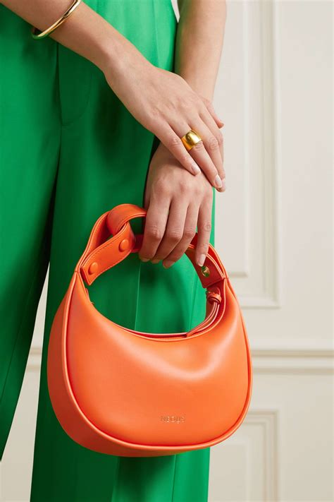 Neous. NEOUS. Live by simple values with NEOUS. Creating sculptural forms, the brand responds to the flux and flow of everyday life with a timeless charm. Handmade in Italy, bags and shoes follow traditional techniques and fluid minimalist lines. 