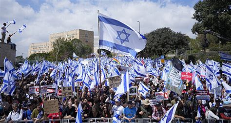 Netanyahu delays Israeli judicial reforms after mass protests
