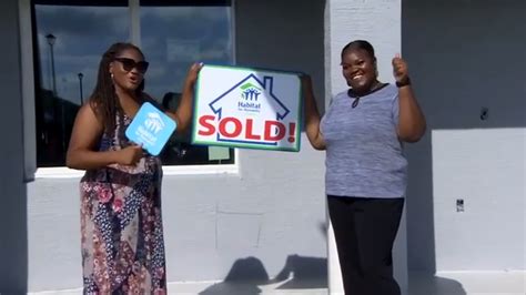 New Habitat for Humanity homeowners get keys from Rita Case in Pompano Beach