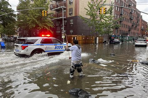 New York City area gets one of its wettest days in decades, as rain swamps subways and streets