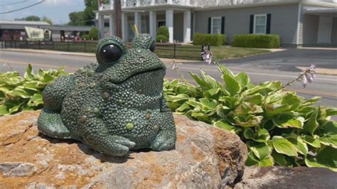 New frog sculptures adorn popular Alton roadside flower garden
