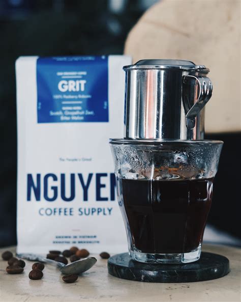 Nguyen coffee supply. Hot water 195º-200º F. 1. Place phin filter plate & brew chamber on top of glass. 2. Add Vietnamese coffee (2 tablespoons or 14 grams per serving) 3. Shake to even out coffee and drop gravity press on top of coffee. 4. Add 1 oz of water (about 1/2 inch of water above the press); bloom for 45 seconds. 
