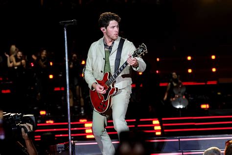Nick Jonas plays it ‘cool’ after tumbling into a hole on stage during Boston concert