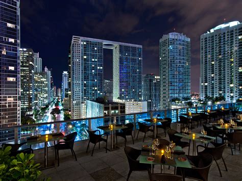 Night Swim Rooftop Bar offers more than just drinks, music, food but also spectacular poolside views of downtown Miami