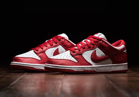 Nike dunk low university red on feet. The shoe’s defining features are Red Swooshes, heels, and rubber outsole. Finishing touches include the Black laces and lining and White midsole. Retailing for $110, look for the Nike Dunk Low ... 