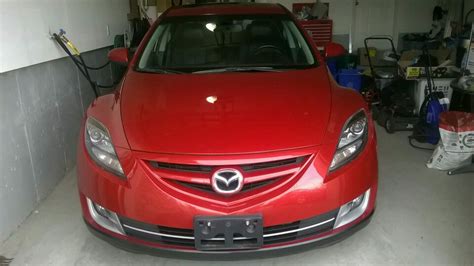 Nissan Leaf and Mazda Atenza in garage fire - which one started it?