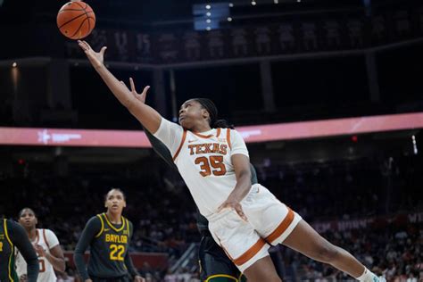 No. 10 Texas hands West Virginia its 1st loss of the season, Booker notches double-double