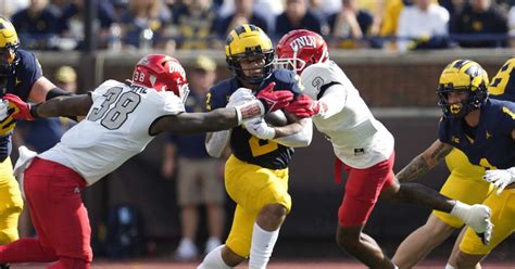No. 2 Michigan to host UNLV without suspended coach Jim Harbaugh and an eye on air attack