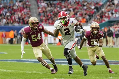 No. 6 Georgia wins matchup of teams missing CFP, routs No. 4 Florida State 63-3 in Orange Bowl