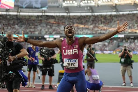 Noah Lyles breaks into tears on medal stand after receiving gold medal for 100-meter win at worlds