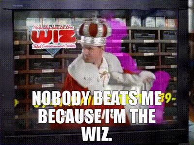 Nobody beats the wiz. On the TV, Jack is The Wiz, the spokesman for Nobody Beats the Wiz, chanting "Nobody beats me, because I'm the Wiz! I'm the Wiz!" Jerry: "That is the guy!" George: "Elaine's in love with the Wiz guy?" Jerry: "No, she thinks she's in love with him 