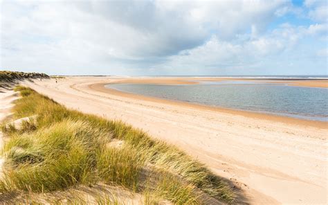 Norfolk beaches. Sep 9, 2023 · Holkham Bay. Warblers, redstarts and flycatchers all call the more arid coastal fringes of Holkham Bay home, while the pine-flecked dunes and fudge-coloured sands of the beach itself is one of the finest Norfolk offers; it even featured in 1998’s Shakespeare In Love. The huge skies, where gulls dance with appropriately cinematic swoops and ... 