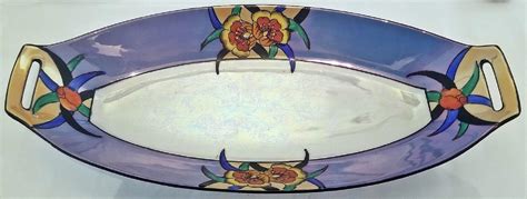 Noritake lusterware patterns.  This hand-painted porcelain piece feature...