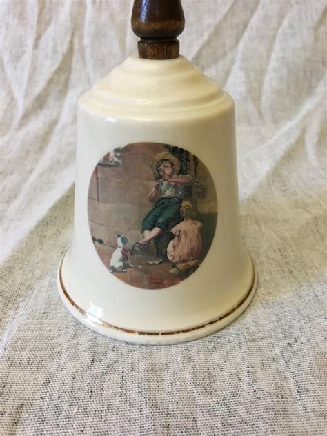 New in the Box! never used!Enhance your collection with these exquisite Danbury Mint Norman Rockwell Collector Bells. This set of 8 porcelain bells is perfect for any room and occasion. The bright, white finish and 1970s style make them a timeless addition to your Christmas collection..
