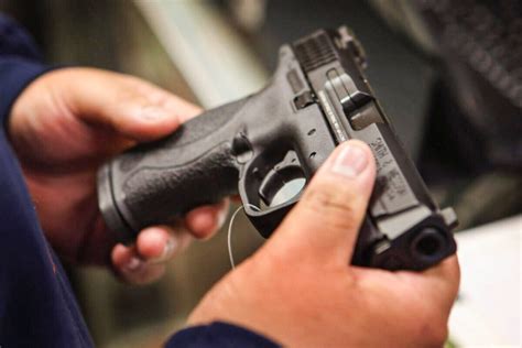 North Carolina lawmakers repeal permit requirement to buy a pistol, overriding Democratic governor’s veto