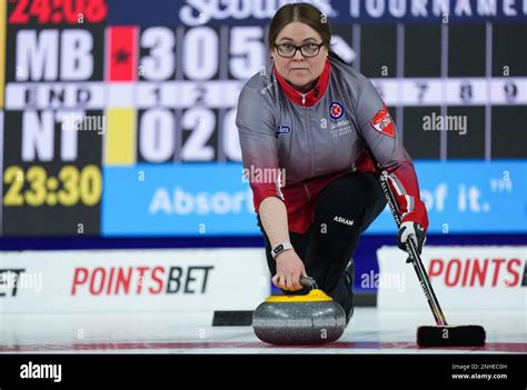 Northwest Territories skip Kerry Galusha delivers a rock while …