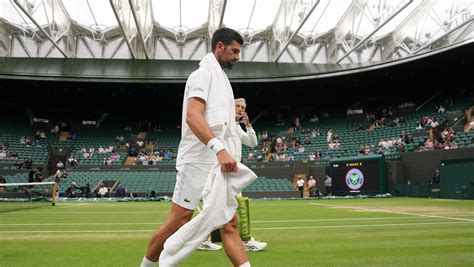 Novak Djokovic and Carlos Alcaraz warm up on No. 1 Court for their Wimbledon semifinal matches