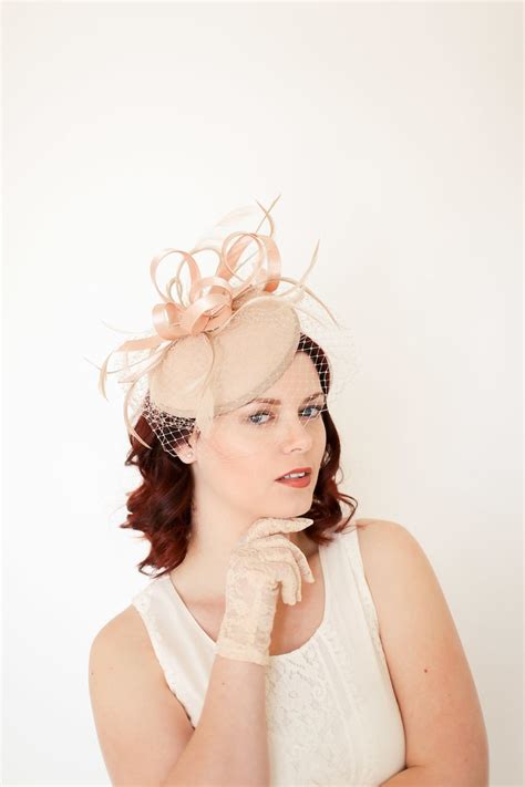 Please browse our range of Pink Fascinators and Pink Hatinators below in a wide range of styles, on alice bands, slides and beak clips. . 