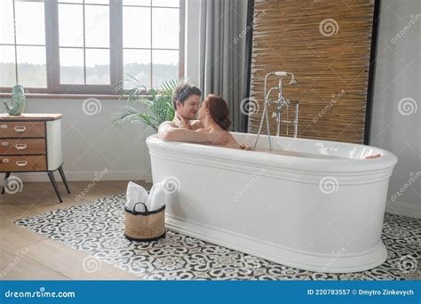 Nude man having bath with nude woman. .  ...