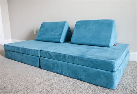 Nuggets couch. The Nugget is covered in a soft, machine-washable microsuede, while the Foamnasium Blocksy is covered in a smooth, wipeable vinyl. In both cases, the covers zip off. The Nugget is a few inches ... 