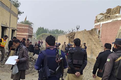 Number of officers killed in suicide attack targeting a police station in northwest Pakistan rises to 22, officials say