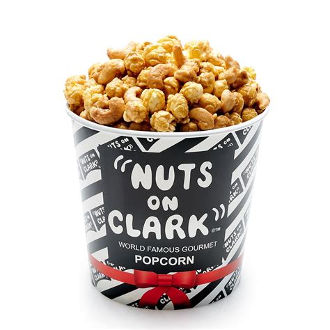 In a souvenir Northwestern Universtiy Tin, "Nuts on Clark" award winning, original caramelcorn mixed with our real cheesecorn handcrafted with Real Wisconsin cheddar cheese. A Chicago icon, delicasey and staple.. Nuts on clark chicago