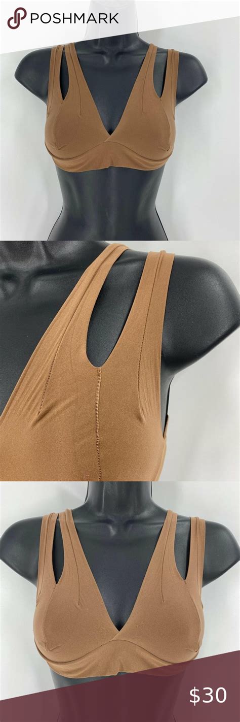 Nuudii system. With 12+ ways to wear, the Tee System can take you from work to wedding and everything in between. Nuudii is not a bra, it is the option between bra and braless. With fabric soft enough to feel like a second skin, Nuudii is formless and gently hugs and cradles your natural shape while providing a subtle lift. Material: 73% Nylon, 27% Elastane ... 