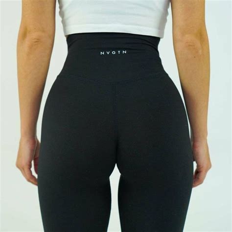 Nvtgn. These new and improved Signature 2.0 Leggings feature a removed front seam, along with a seamless waistband that lays so effortlessly on the body. These leggings will become an essential in your wardrobe whether it’s to the gym or lifestyle. Pair these with any of our tops or hoodies to complete the look! - Nylon and spandex. 